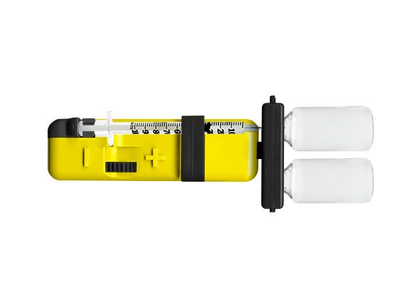 Prodigy COUNT-A-DOSE Insulin Measurer with two vials and syringe mounted to the unit.