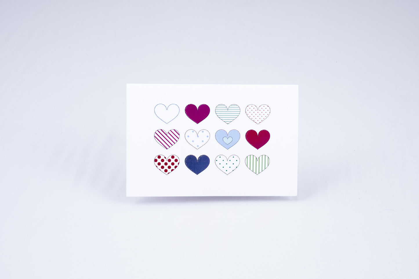Multi-heart card, 12 different hearts arranged in a 4x3 grid, with different colors and textures on each.