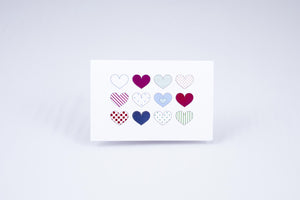 Multi-heart card, 12 different hearts arranged in a 4x3 grid, with different colors and textures on each.