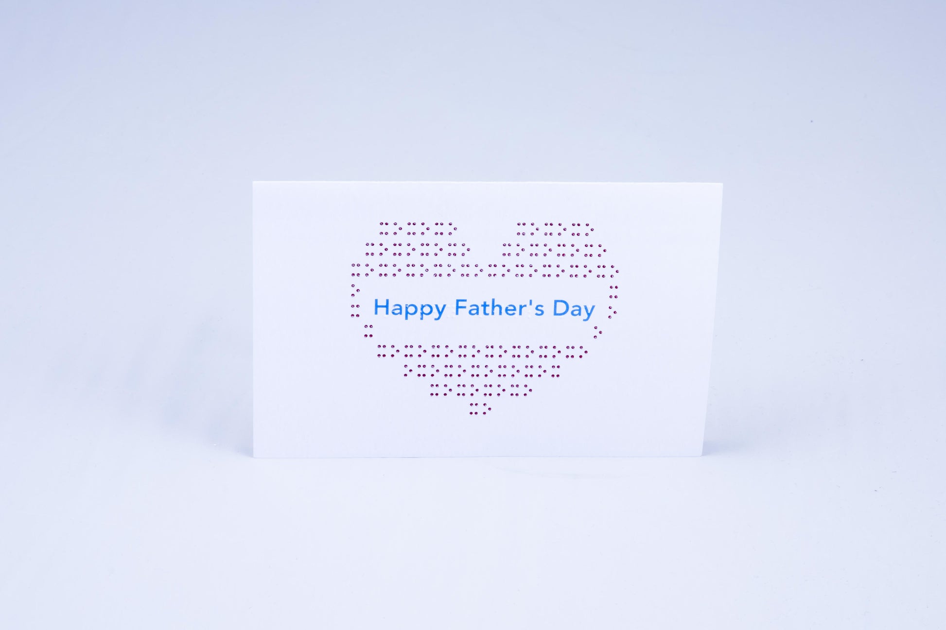Happy Father's day heart card, with a heart made out of X's and O's.