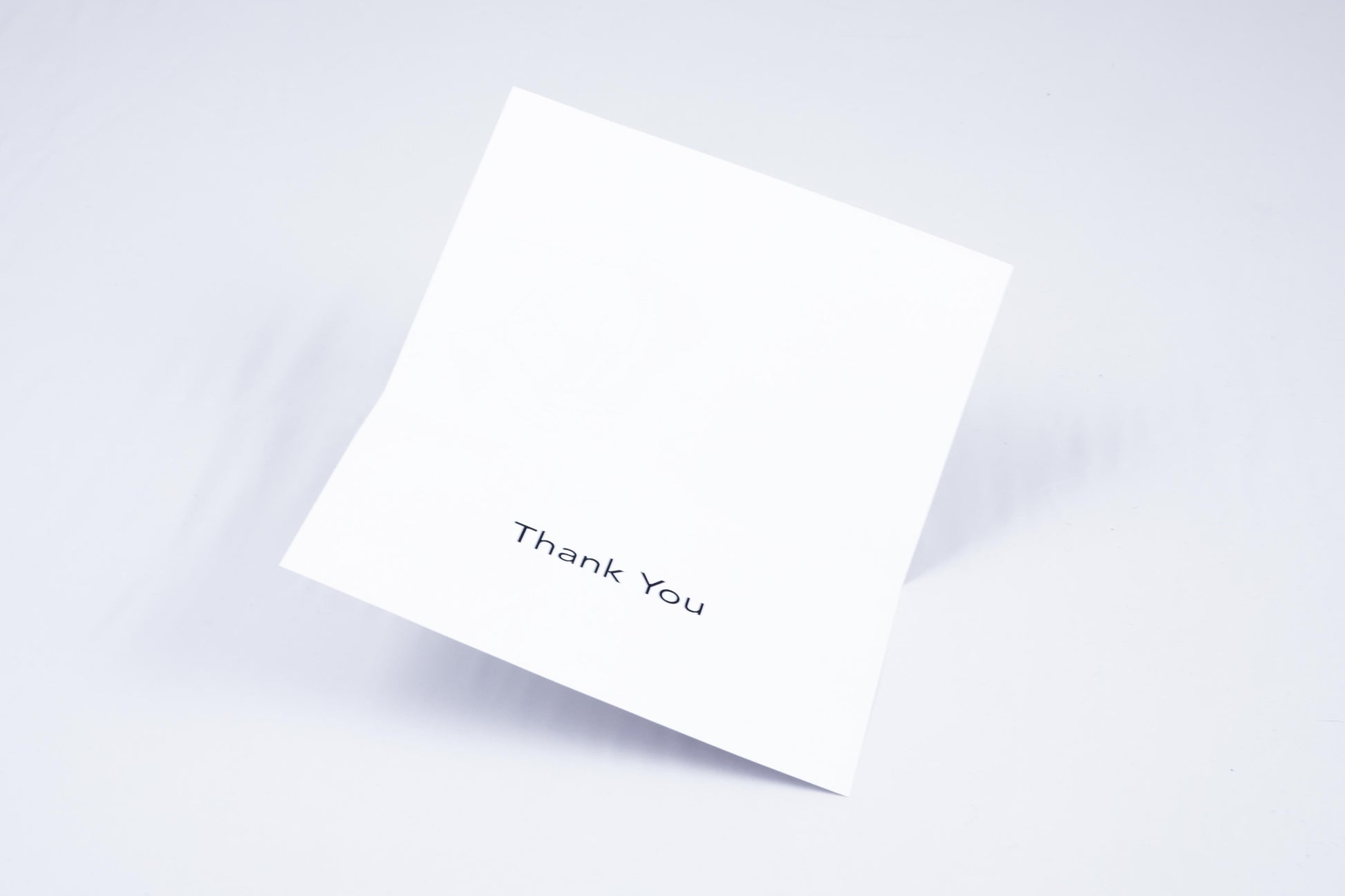 Inside of both cards, which simply reads "Thank You" in large print and Braille.