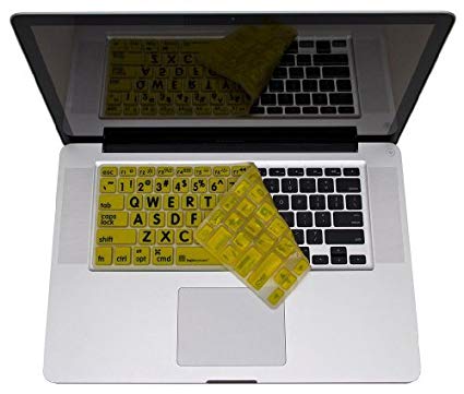 Large Print Black on Yellow Macbook Keyboard Skin shown pealed back on a keyboard