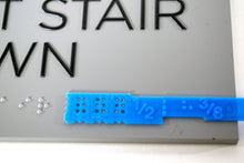 Load image into Gallery viewer, Sign template testing Braille on a Stair exit sign.