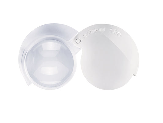 Eschenbach Mobilent LED circular magnifier folded up. White plastic case, edge of translucent magnifier lens visible.