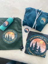 Load image into Gallery viewer, Collection of EHC merchandise, all with new EHC logo. Collection includes a water bottle, lite weight sports sack, t-shirt, hoodie, and clear plastic cup.