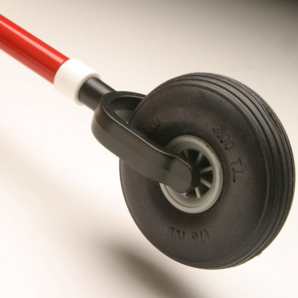 Close-up of the ambutech free-wheeling roller tip, a black wheel held in place on both sides attached to a white cane.