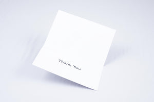 Inside of both cards, which simply reads "Thank You" in large print and Braille.