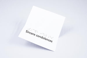 "Sincere Condolences" written in Braille and large print on the inside of the card.