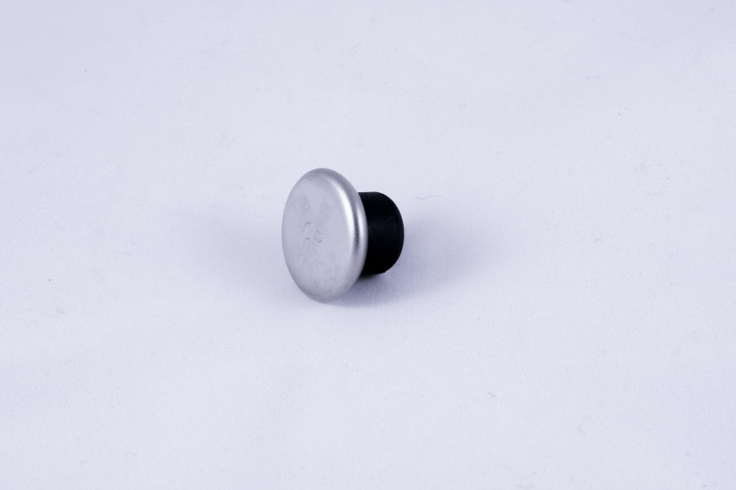 Circular metal cane tip on a black rubber fixture.
