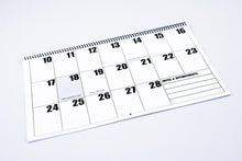 Load image into Gallery viewer, 2023 Calendar photograph, showing the product&#39;s spiral binding and an example of 1/2 of one month.
