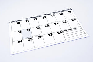 2023 Calendar photograph, showing the product's spiral binding and an example of 1/2 of one month.